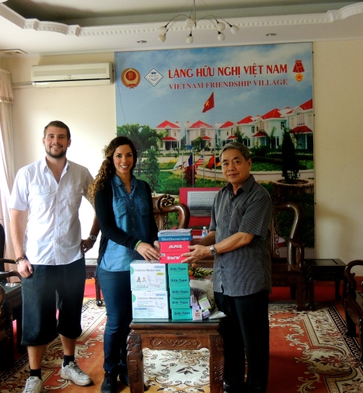 Joerie (left) and Yaiza (middle) from The One Chance Project donating medical supplies to Mr. Dong (right) from The Friendship Village
